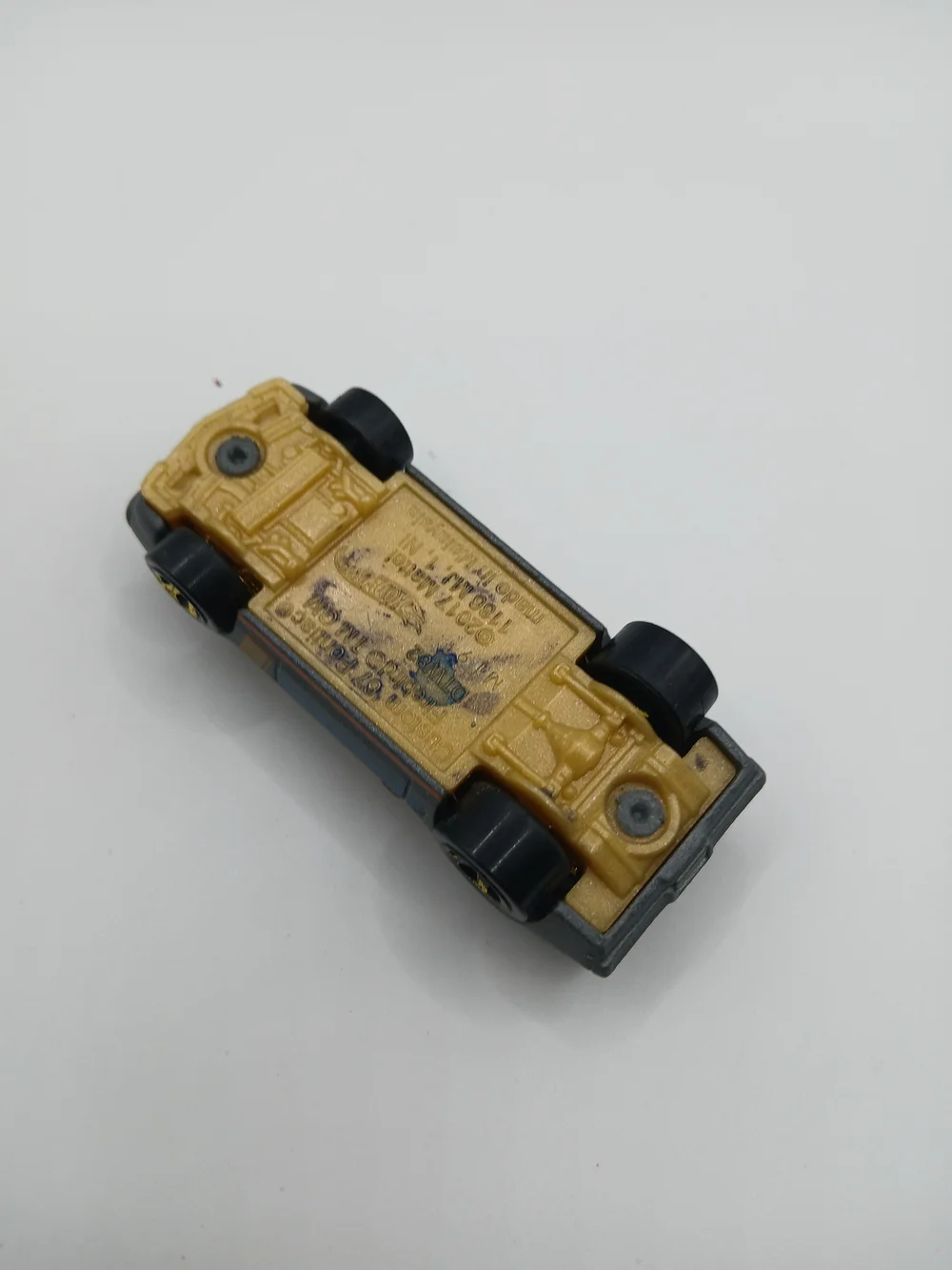 Gray Toy Muscle Car with Gold Engine Detail